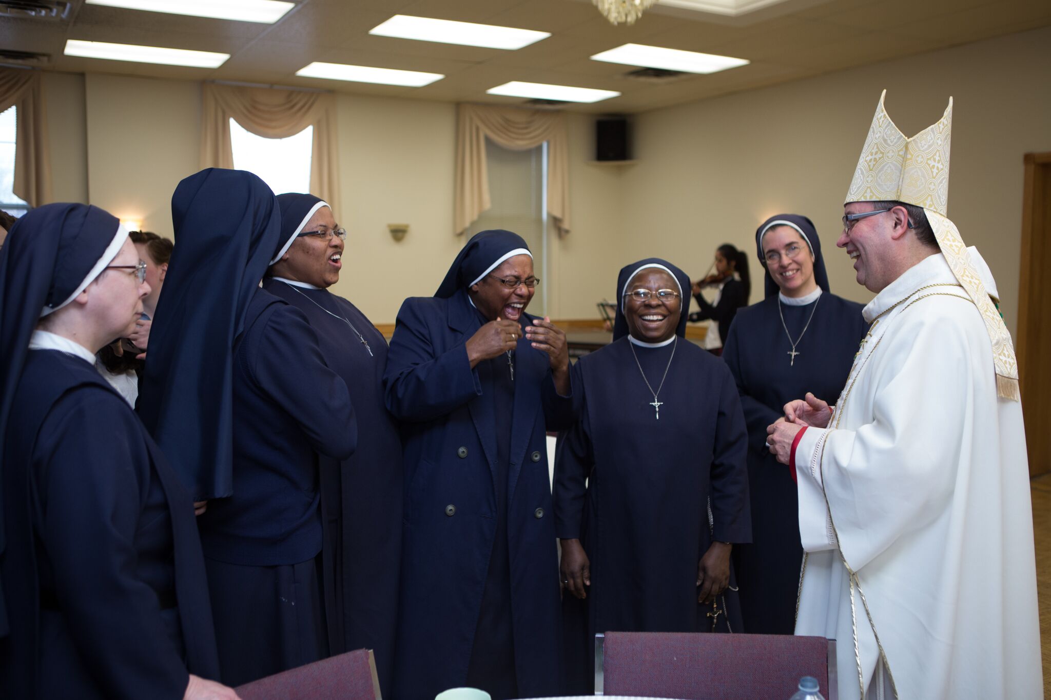 SOLI Sisters sharing a laugh with His Excellency