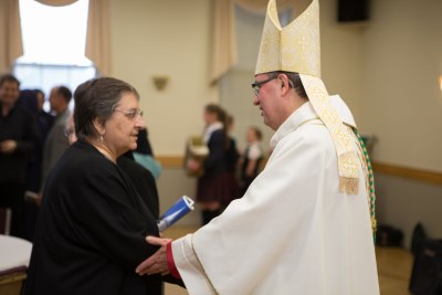 CSJ Sister greeting His Excellency Most Reverend Bishop Miehm
