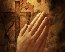 Hands clasped together in prayer